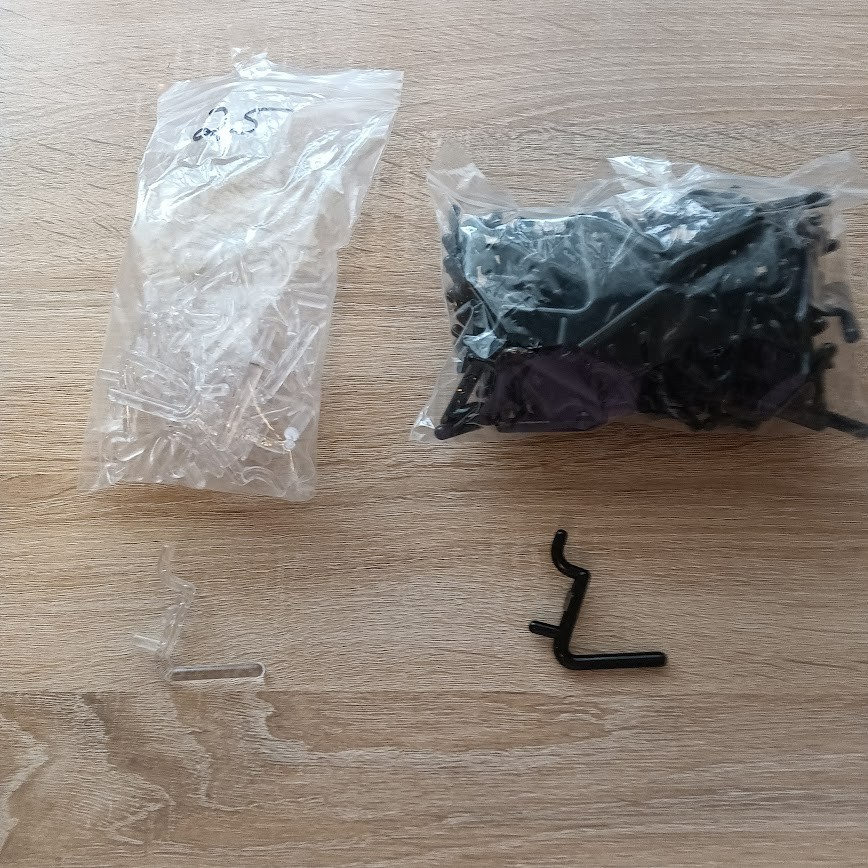 Black and Clear Plastic 1.50 Inch Pegs About 95 Pieces Used