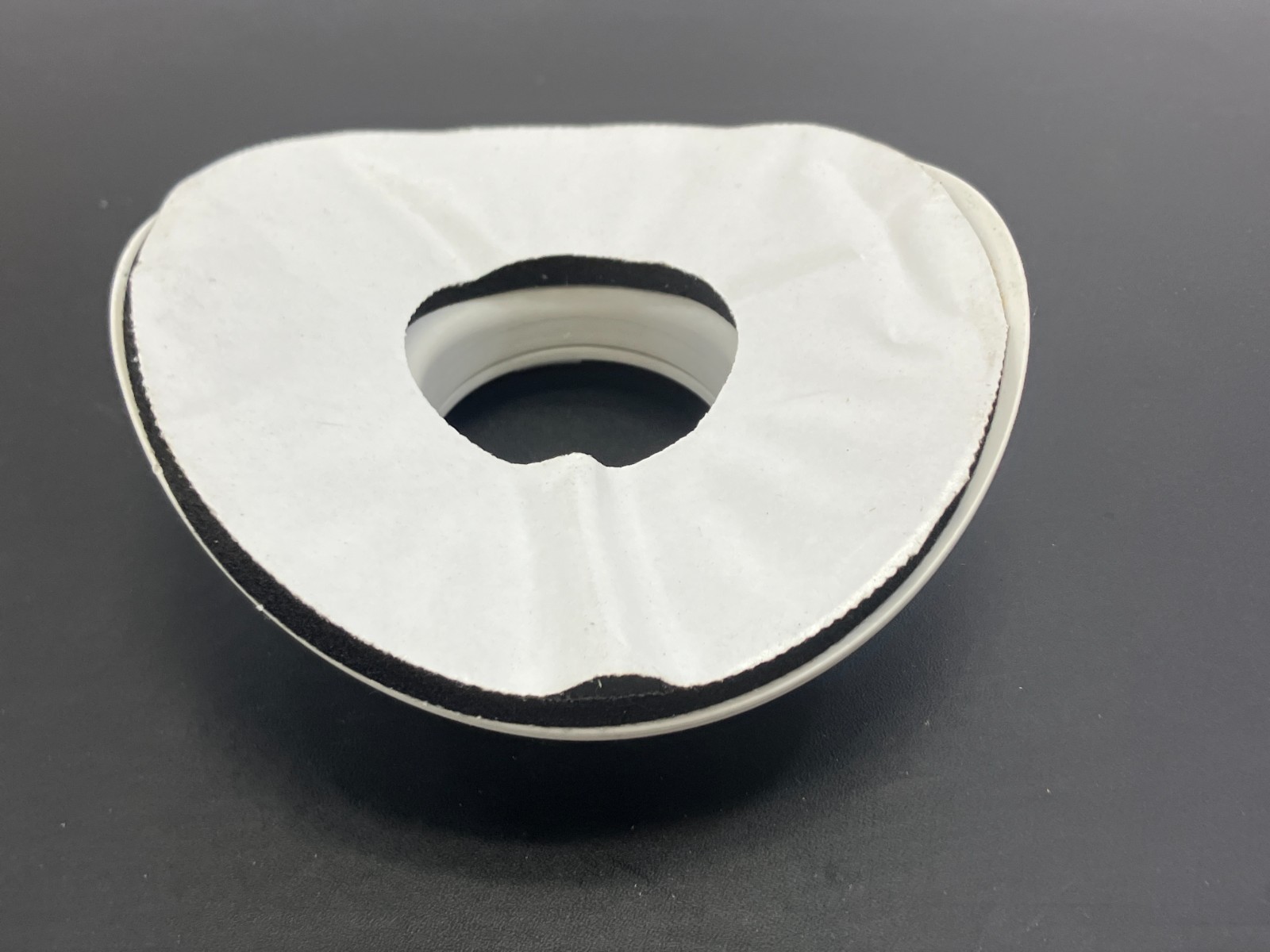 Unico System Saddle Style white round supply outlet for a high-velocity HVAC