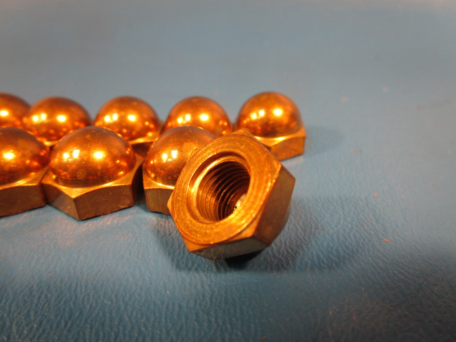 Package of 24 GRAINGER 6NU62, Cap Nut: 3/8″-24 Thread, Plain, Brass, 0.5 in Hex