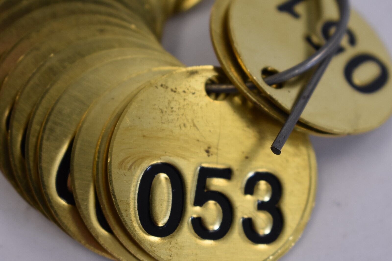 BRADY 23202 Numbered Tag Stamped Black on Brass 1-1/2″ Circle 051-075 25 Pack