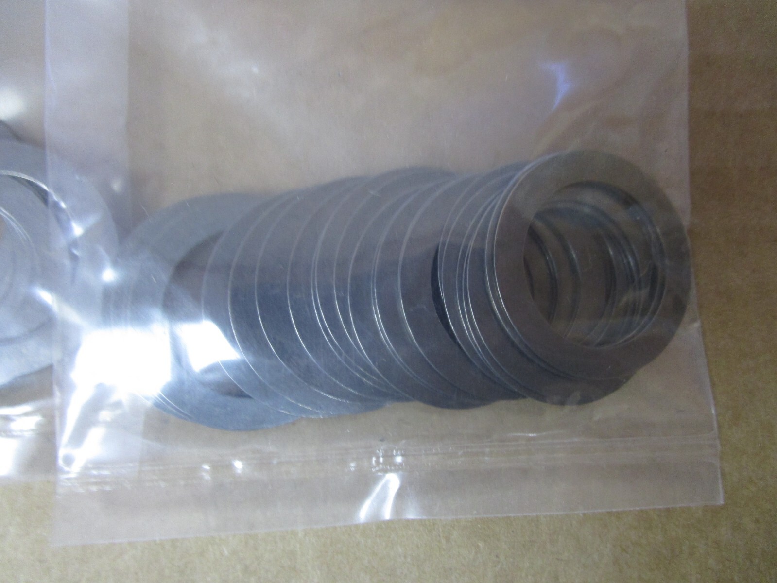 NEW LOT OF 100 McMASTER CARR SHIM RINGS 988-SPR STL-20X28X.5