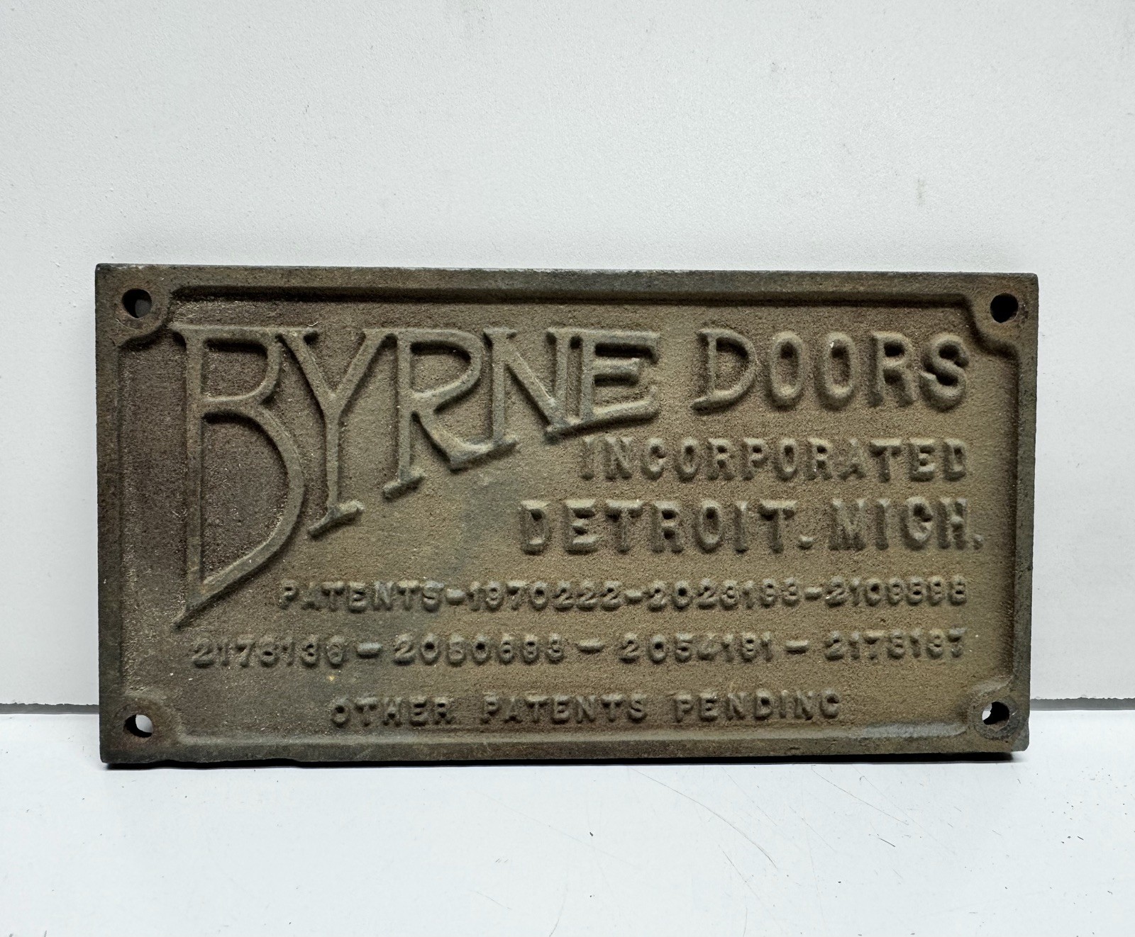Vintage Iron Byrne Doors Inc. Detroit Mich 6.25″ x3.25″x.1875″thick Badge