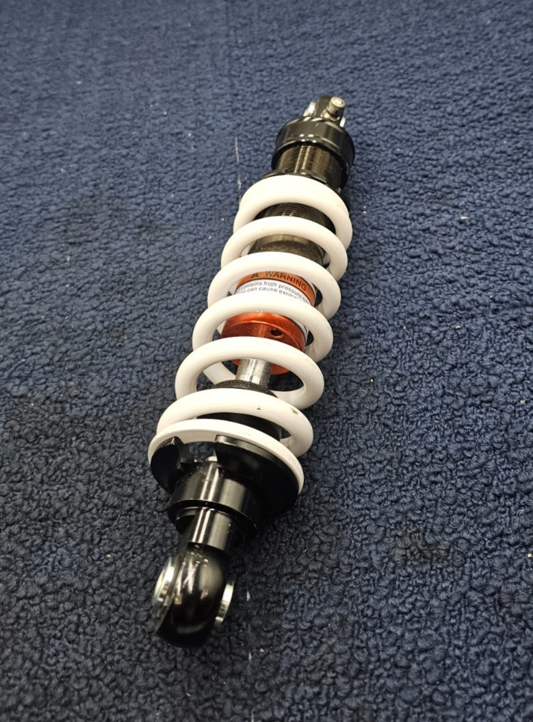 2508231141 Adjustable Shock Absorber Black Body, White Spring