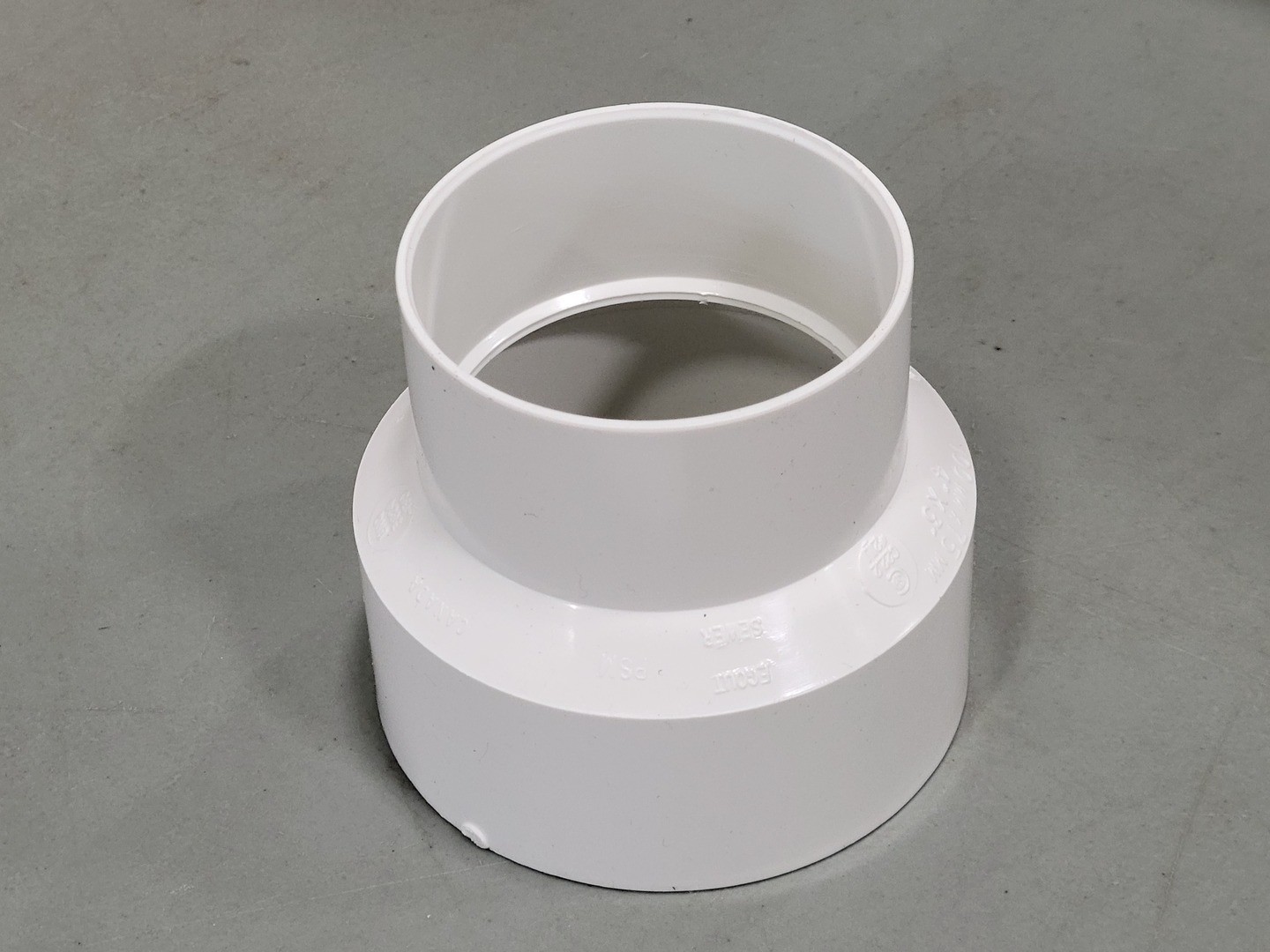 CANPLAS 414217BC 4″ x 3″ PVC Sewer Increaser Coupling w/ Pipe Stop (Box of 24)
