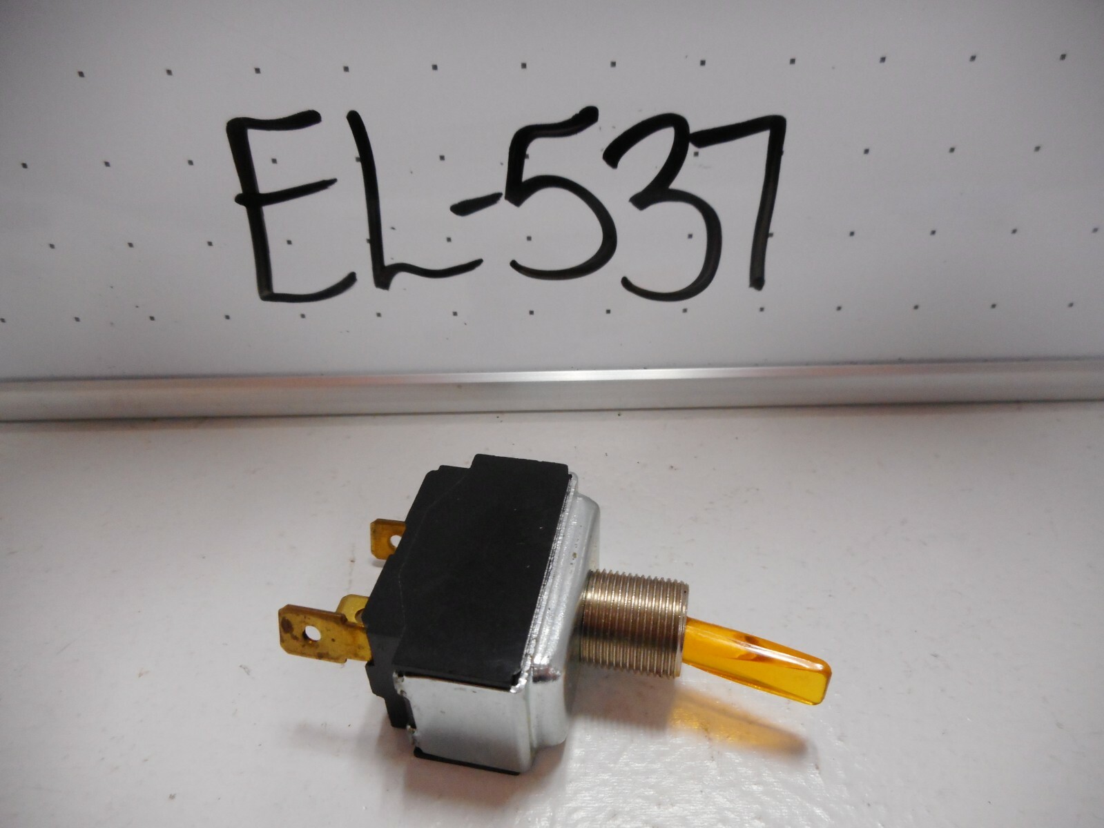 NOS SPST ILLUMINATED AMBER TOGGLE SWITCH, 14V LAMP, 15 AMP
