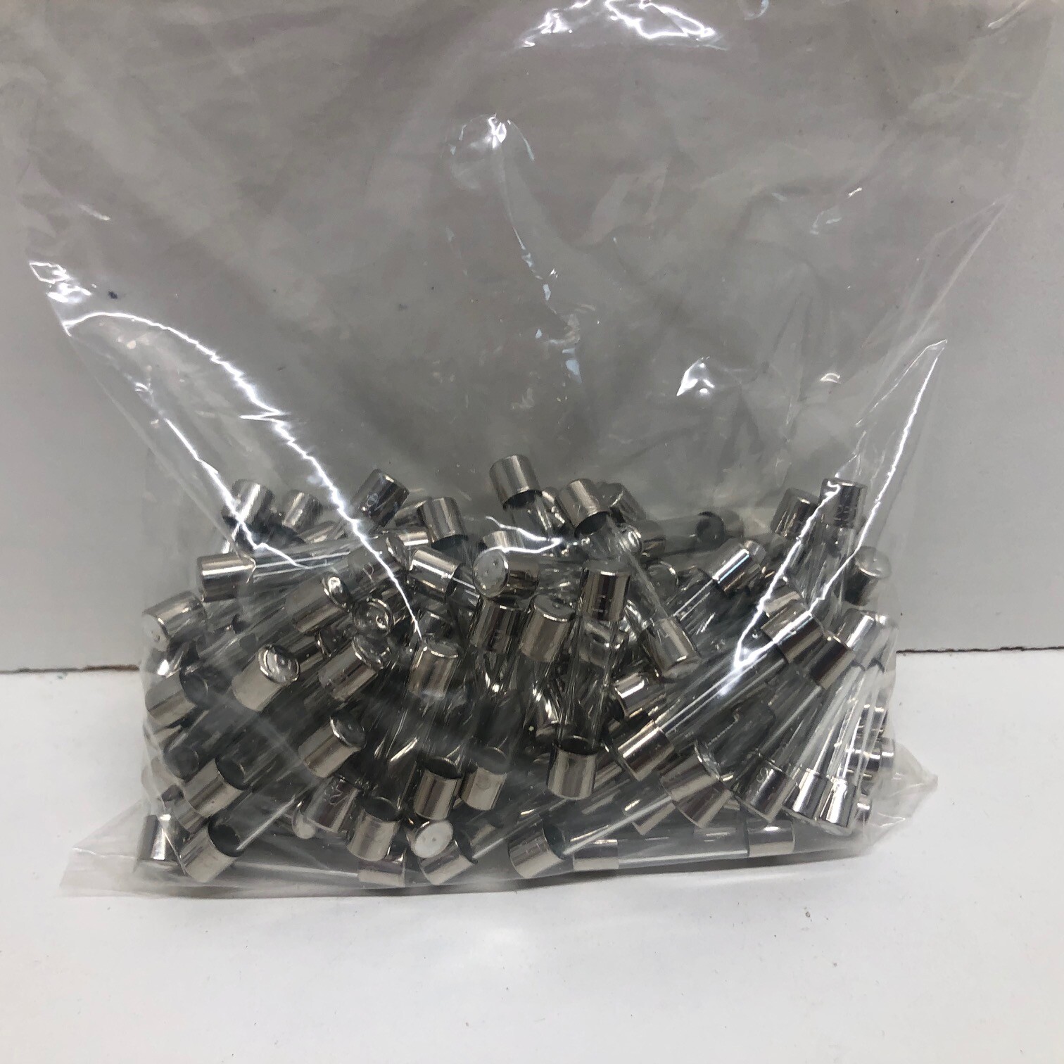 BAG OF 100 NEW! LITTELFUSE .100A 250V CARTRIDGE FUSES 0312.100MXP