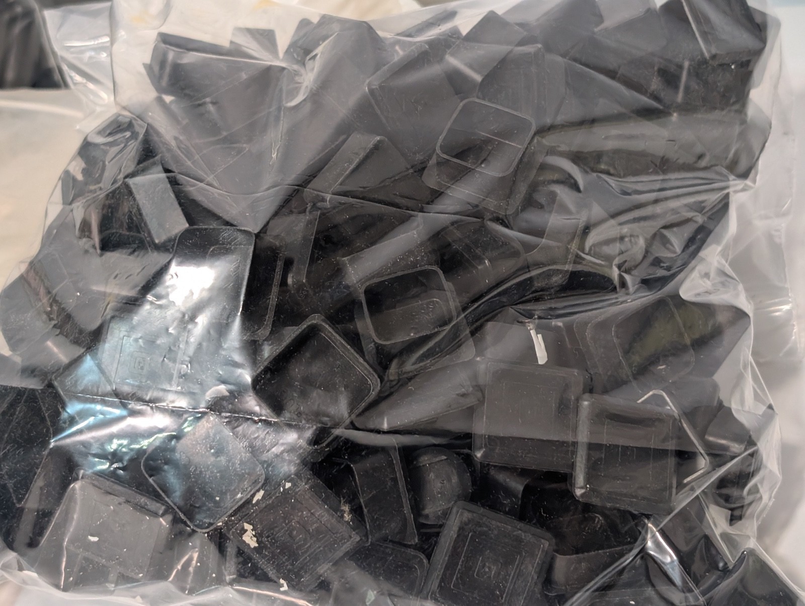Lot of Approx. 700 Assorted Plastic Caps and Car Plugs, Various Sizes