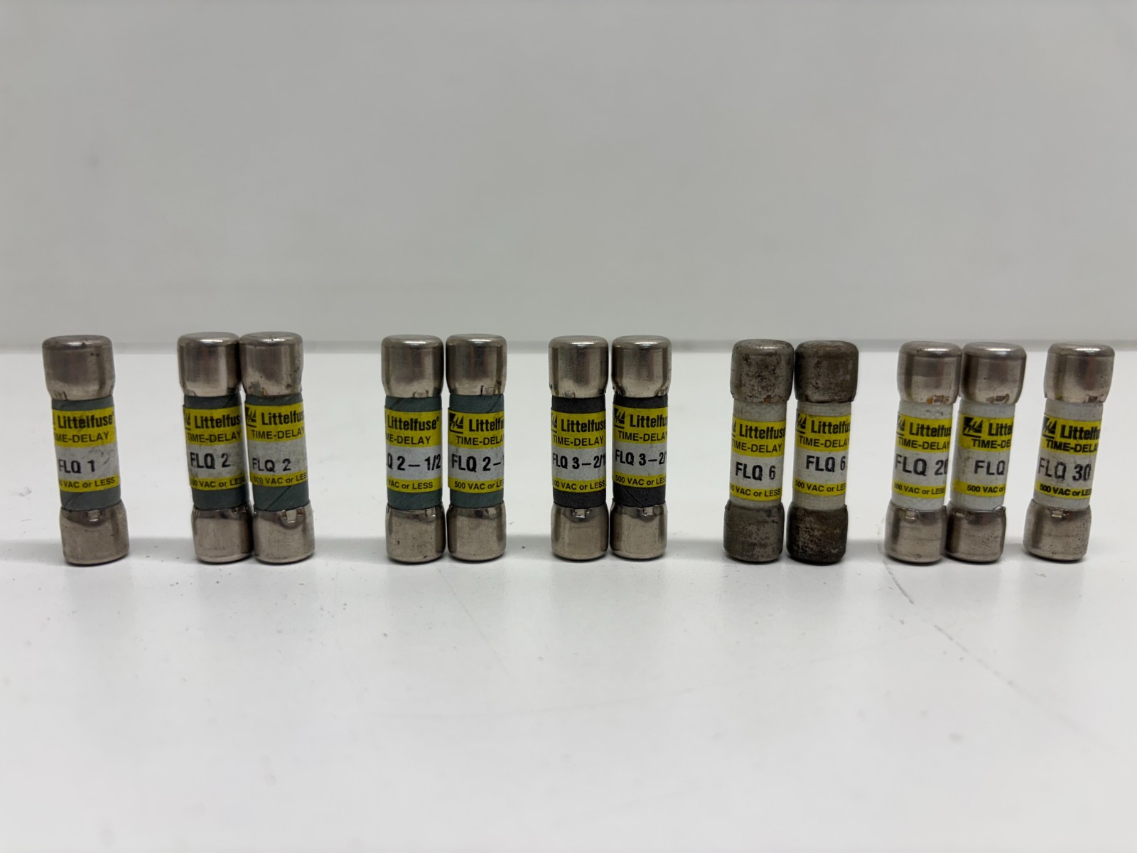 MIXED LOT OF 12 NOS! LITTELFUSE 500V VARIED AMP TIME DELAY FUSES FLQ1 – FLQ30