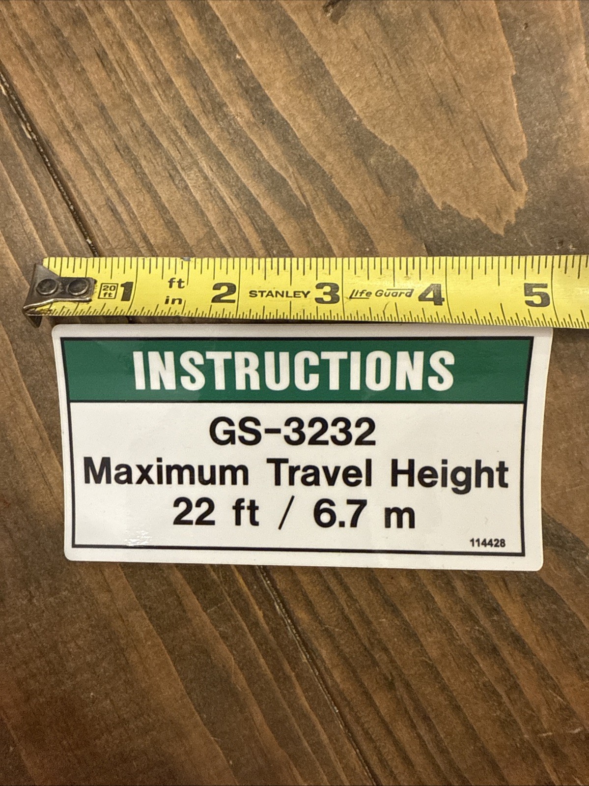Genie GS-3232 scissor lift travel height decal. OEM part # 114428GT. New