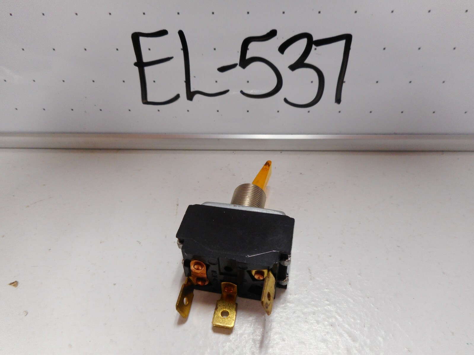 NOS SPST ILLUMINATED AMBER TOGGLE SWITCH, 14V LAMP, 15 AMP