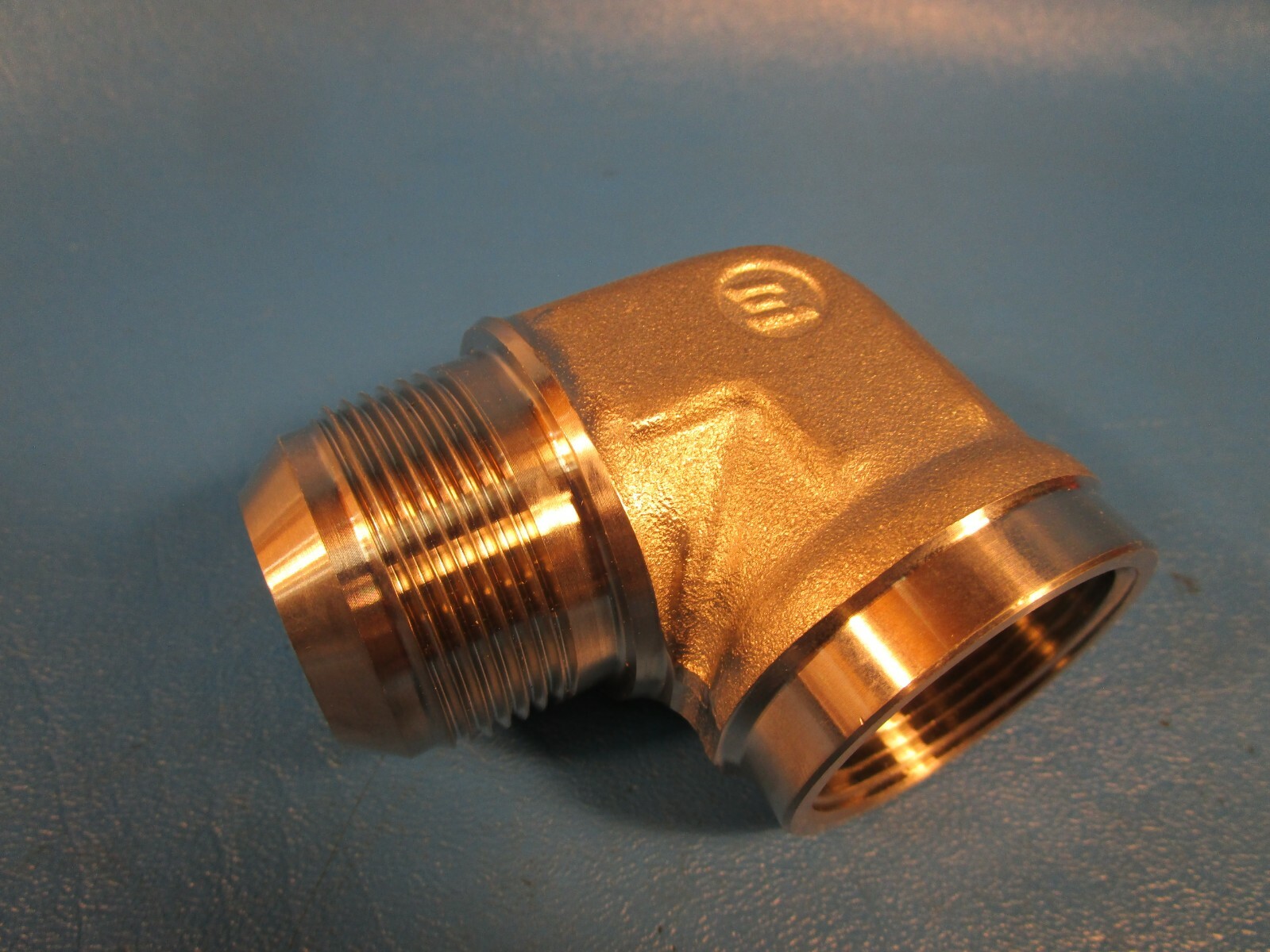 Brennan 2502-20-20SS, 90 Degree Elbow 1 1/4″ Female Pipe x 1 1/4 Male Flare