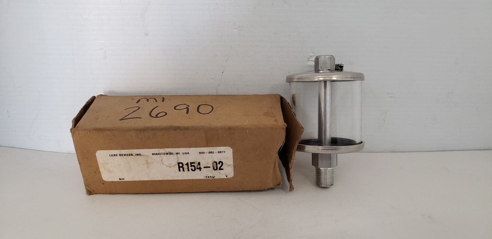 LUBE DEVICES R154-02 OILER, POLYMER BOWL, 1/4 NPTF OUTLET, 2″ DIA. x 3-3/4″, NIB