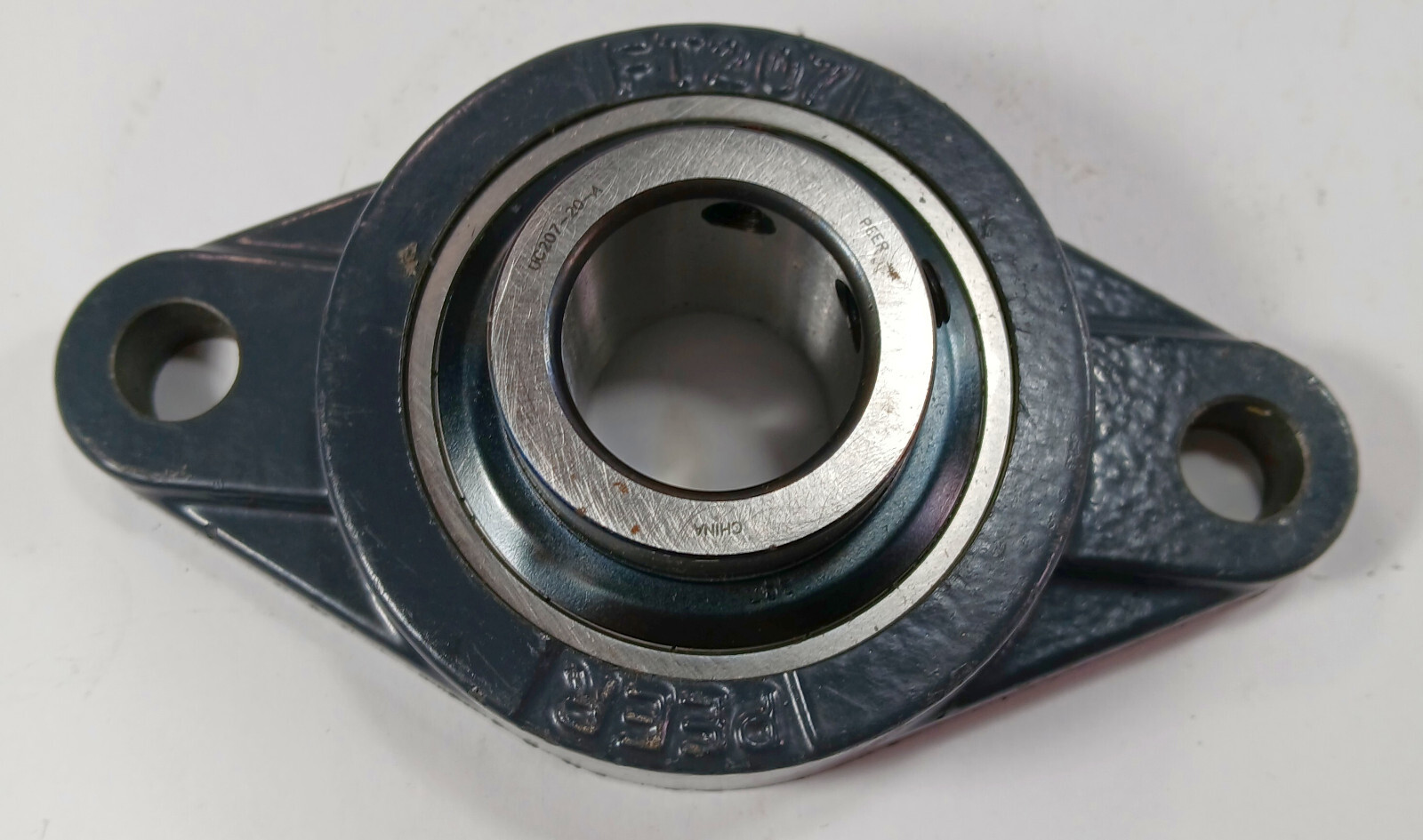 1 NEW PEER FT207 2 BOLT FLANGE W/ UC207-20-A INSERT BEARING NNB ***MAKE OFFER***