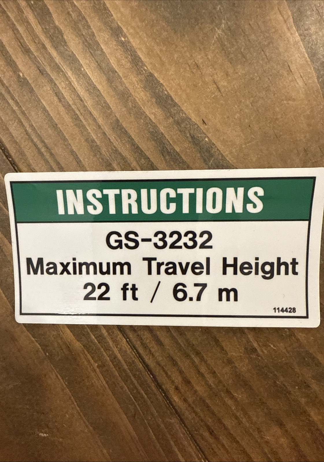 Genie GS-3232 scissor lift travel height decal. OEM part # 114428GT. New