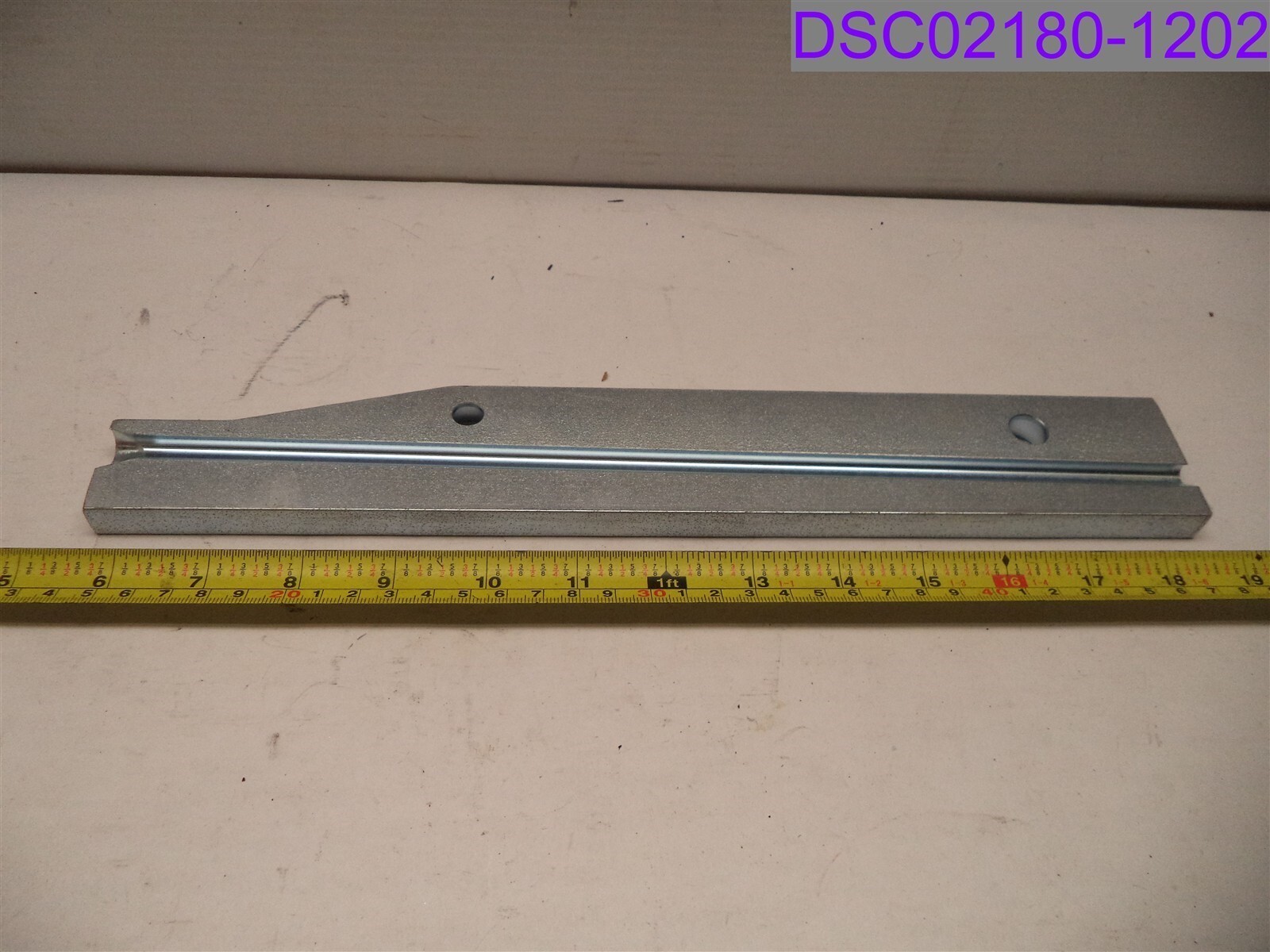 AW 54427. 13-3/8″ L x 2″ tapering to 1-3/8″. 1/2″ thick. 5/8″ front bore