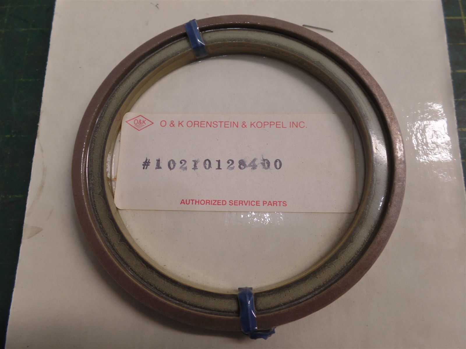 GENUINE TROJAN O&K 10210128400 PISTON SEAL ASSEMBLY, TEREX 10-210128400, N.O.S