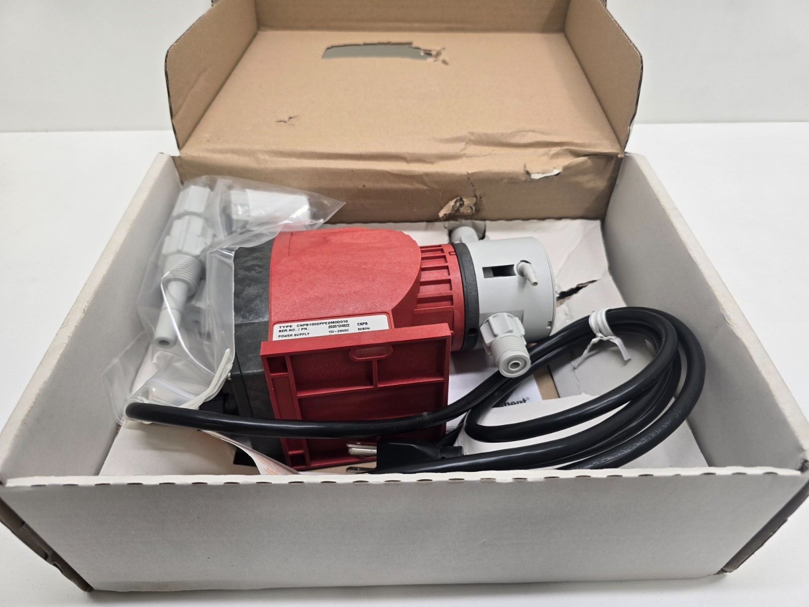 NEW IN BOX! PROMINENT FLUID CONTROLS DOSING PUMP CNPB1002PPE2M0D010