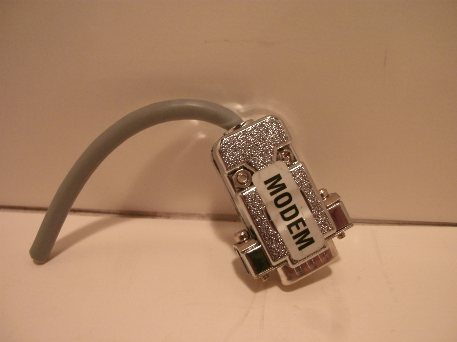 GENERIC MODEM PLUG 9 PIN WITH 3 INCH CORD PLASTIC PLUG CHROME FINISH
