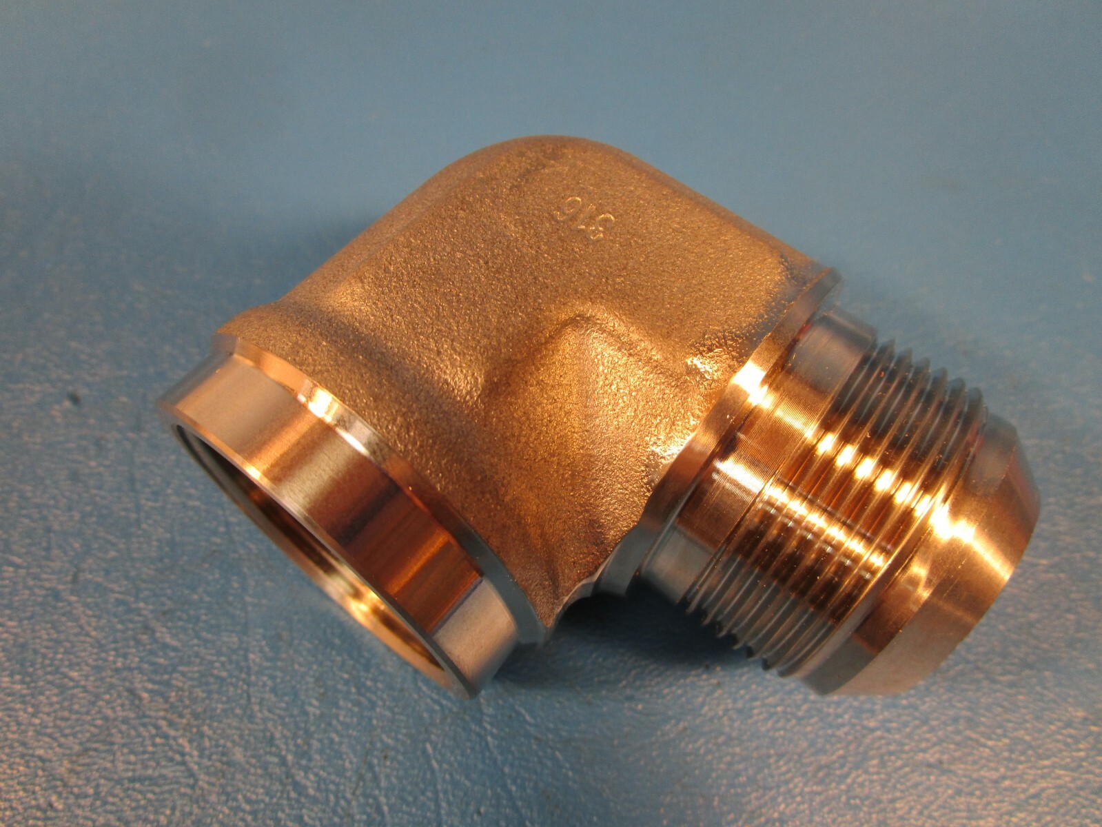 Brennan 2502-20-20SS, 90 Degree Elbow 1 1/4″ Female Pipe x 1 1/4 Male Flare