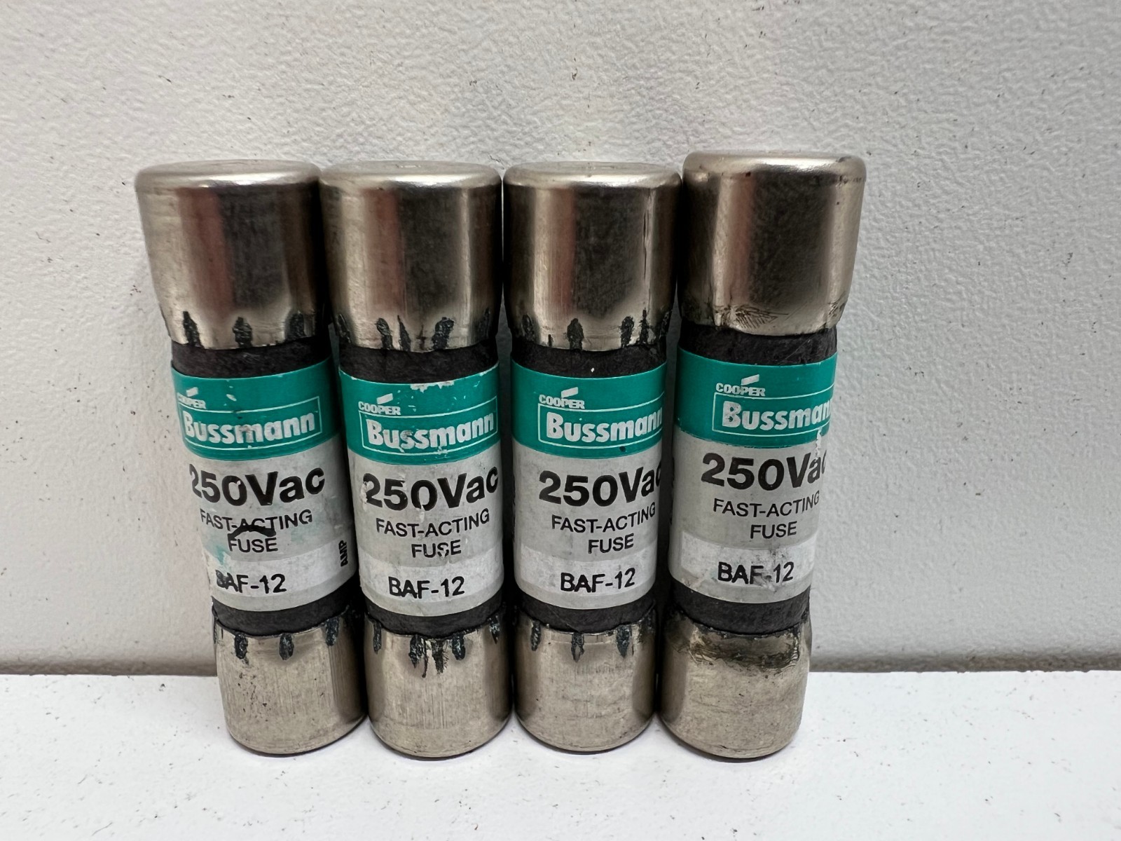 LOT OF (4) NEW OLD STOCK! BUSSMANN 12A 250V FAST ACTING FUSES BAF-12