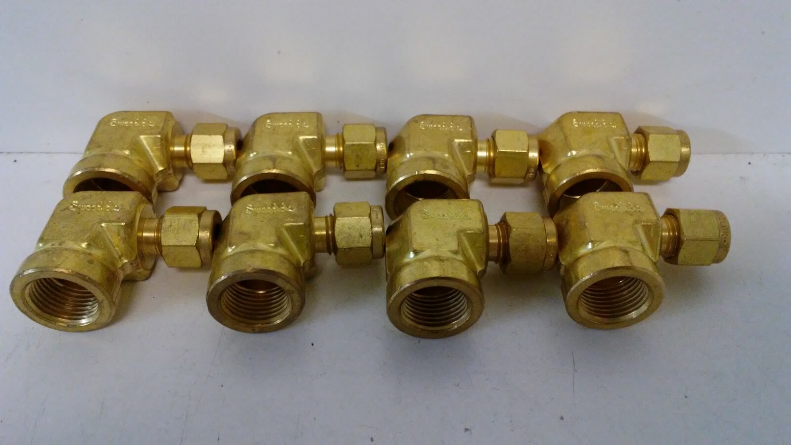 LOT OF (8) NEW OLD STOCK! SWAGELOK 1/4″ X 5/8″ BRASS FEMALE ELBOWS B-400-8-10