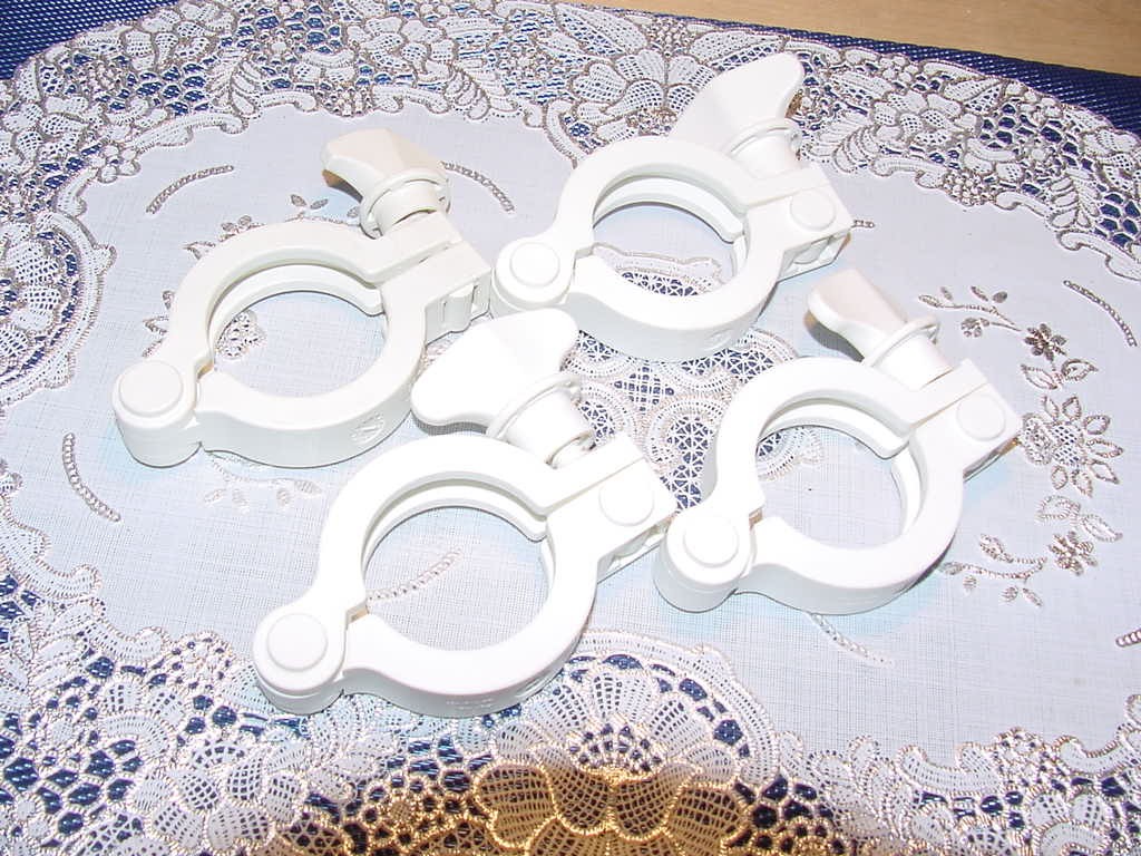 Four (4) MasterFlex 31201-44, 1.5-inch Non-Metallic Sanitary Hinged Clamps Used