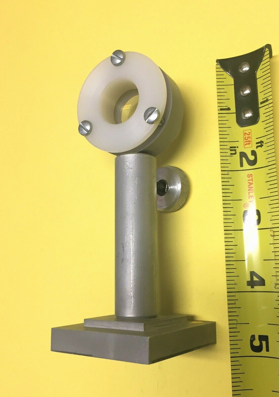 Mounted 1″ diameter lens on post in vertical post holder with base