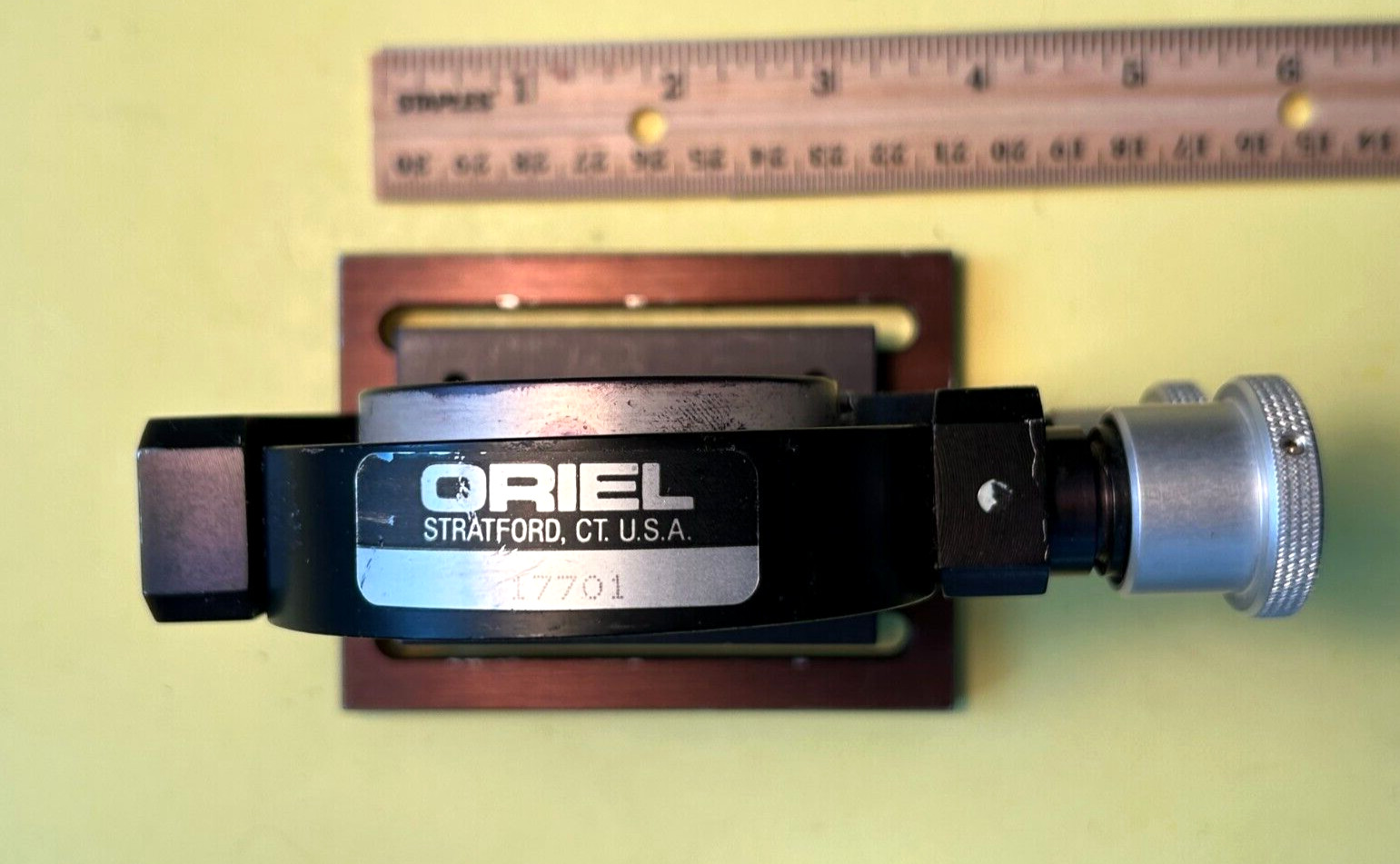 Oriel model 17701 Gimbal mirror mount on baseplate with mirror.