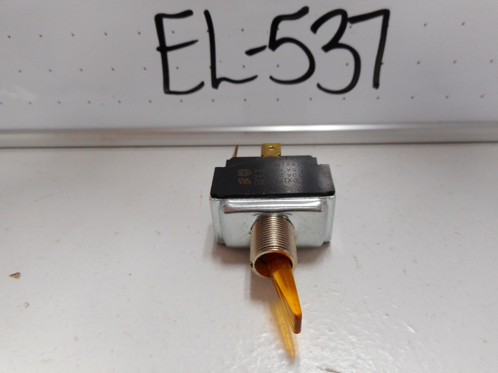NOS SPST ILLUMINATED AMBER TOGGLE SWITCH, 14V LAMP, 15 AMP