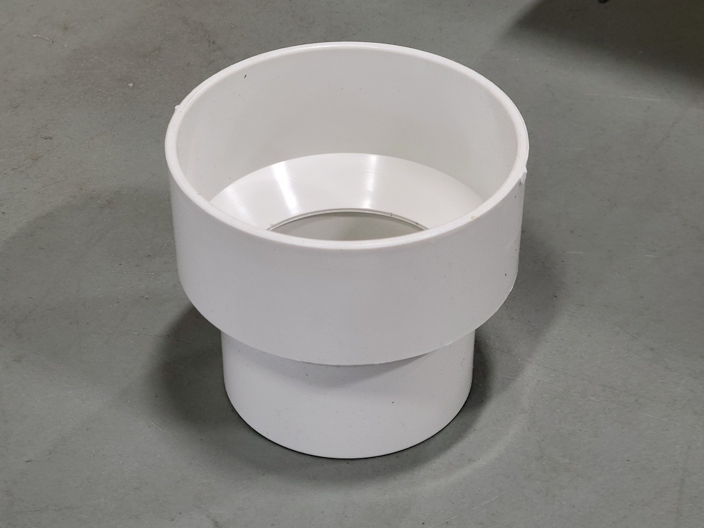 CANPLAS 414217BC 4″ x 3″ PVC Sewer Increaser Coupling w/ Pipe Stop (Box of 24)