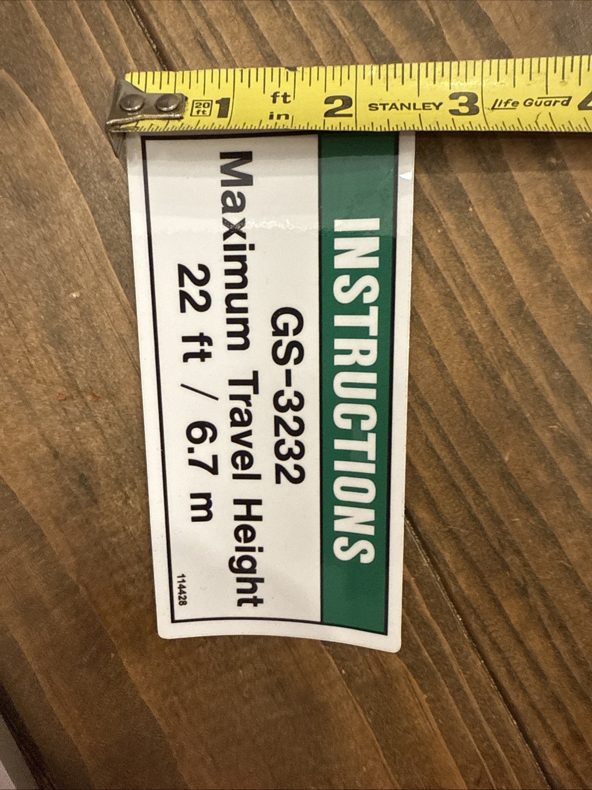 Genie GS-3232 scissor lift travel height decal. OEM part # 114428GT. New