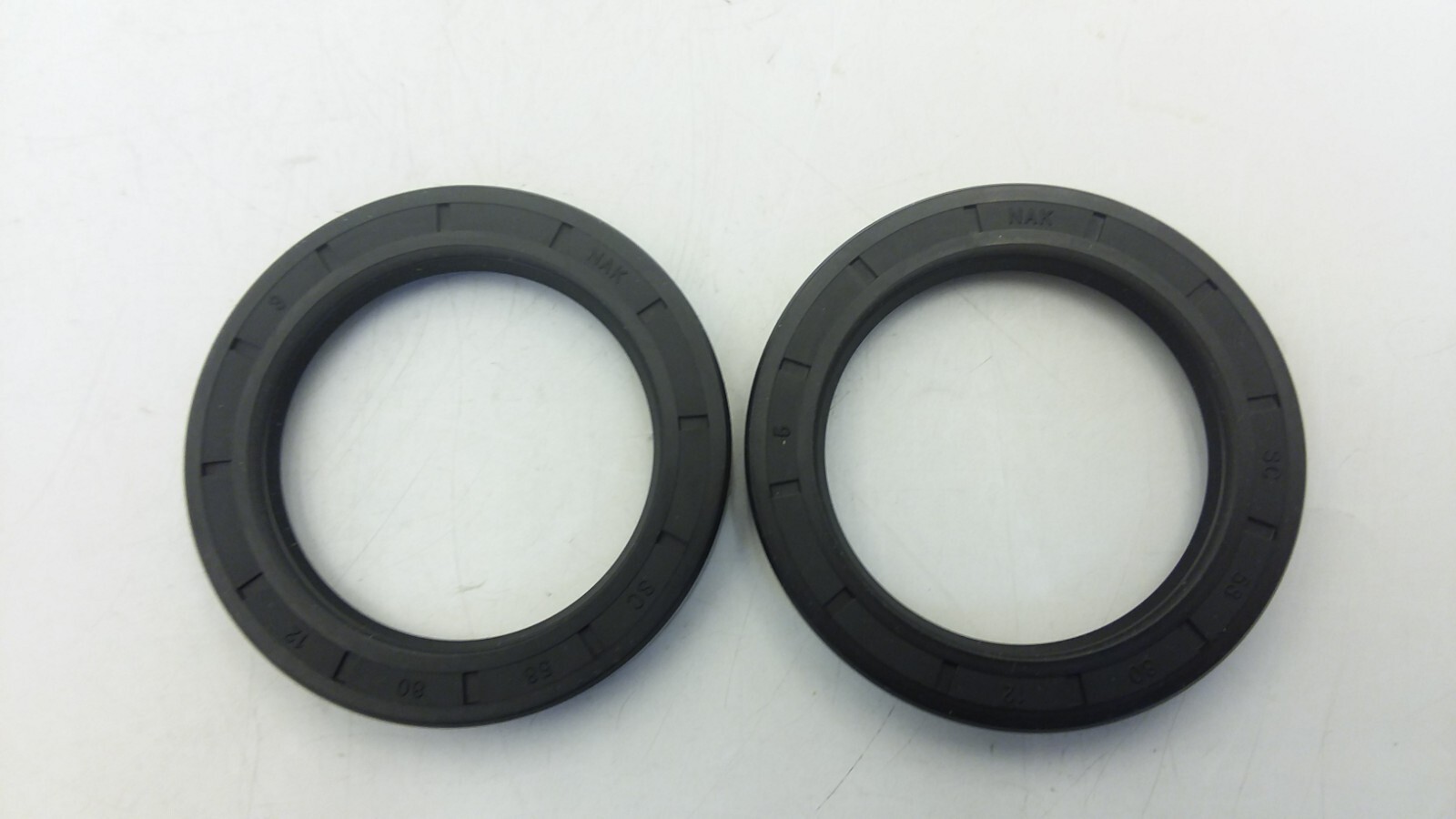 TCM 58X80X12SC-BX METRIC OIL SEAL 58MM SHAFT 80MM OD 12MM WIDTH LOT OF 2 NIB