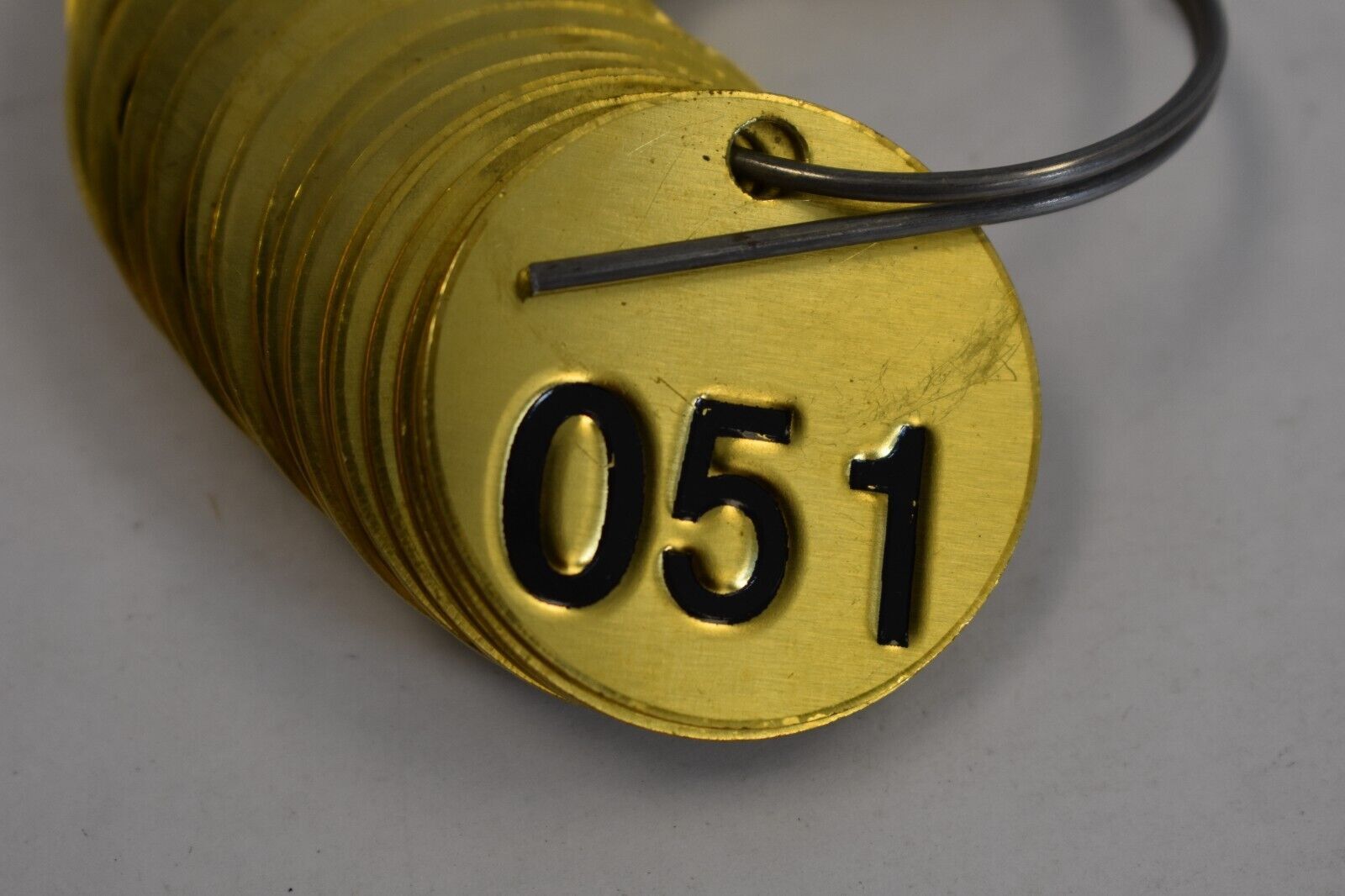 BRADY 23202 Numbered Tag Stamped Black on Brass 1-1/2″ Circle 051-075 25 Pack