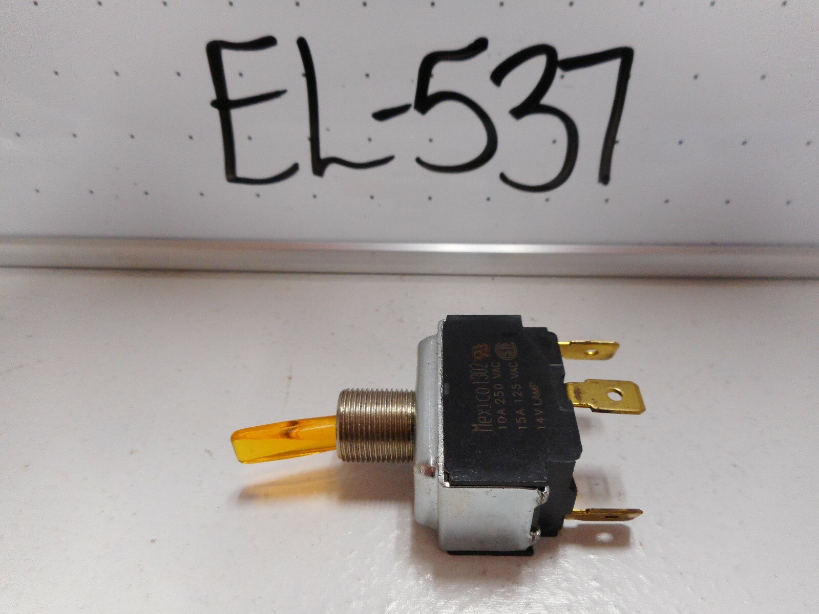 NOS SPST ILLUMINATED AMBER TOGGLE SWITCH, 14V LAMP, 15 AMP