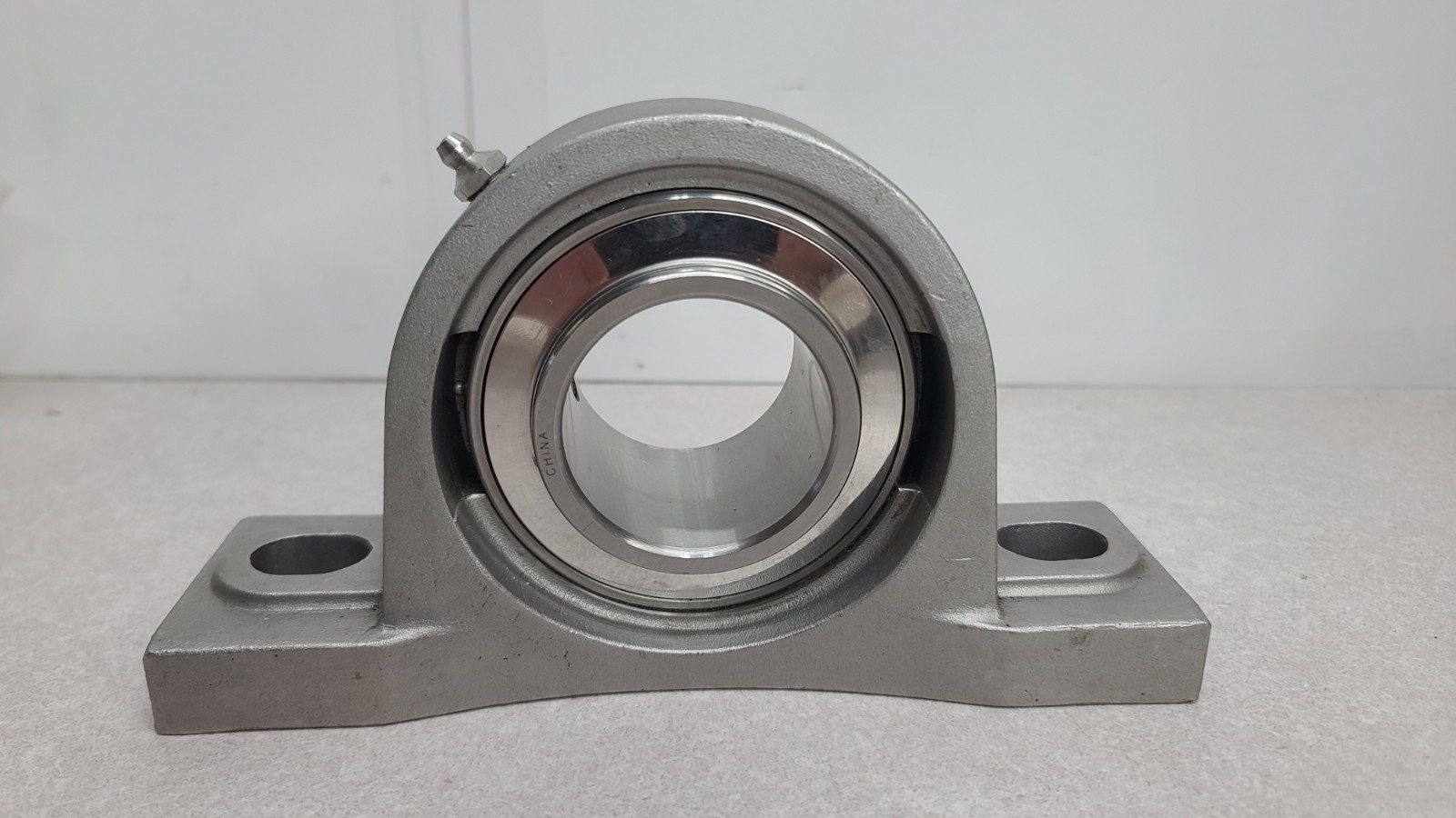 IPTCI SP210 SS Bearing Housing W/ SUC210-32g 2″ Bearing