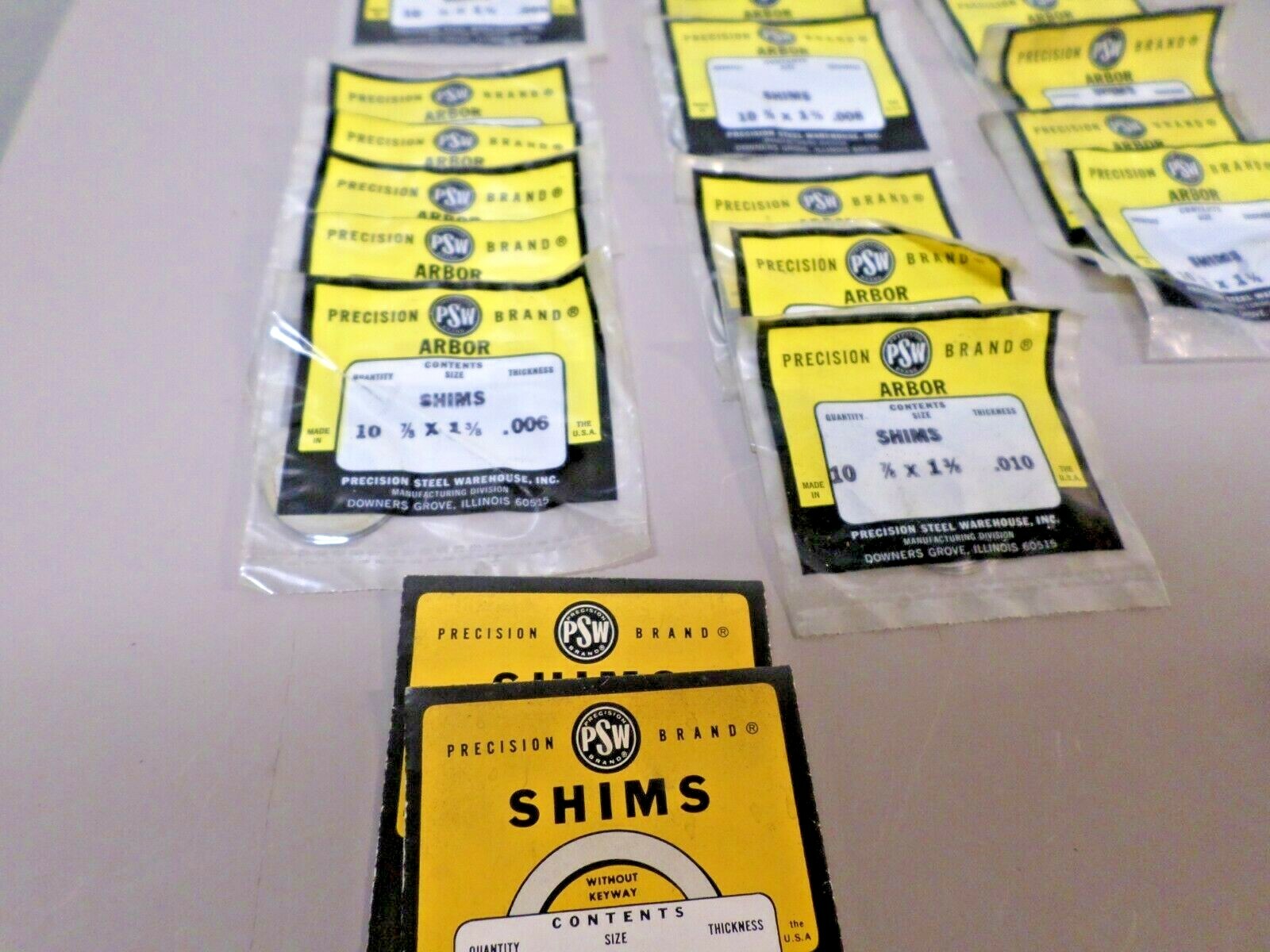 Lot of New Old Stock PSW 7/8″ ID x 1-3/8″ OD Arbor Shims .0001 – .010