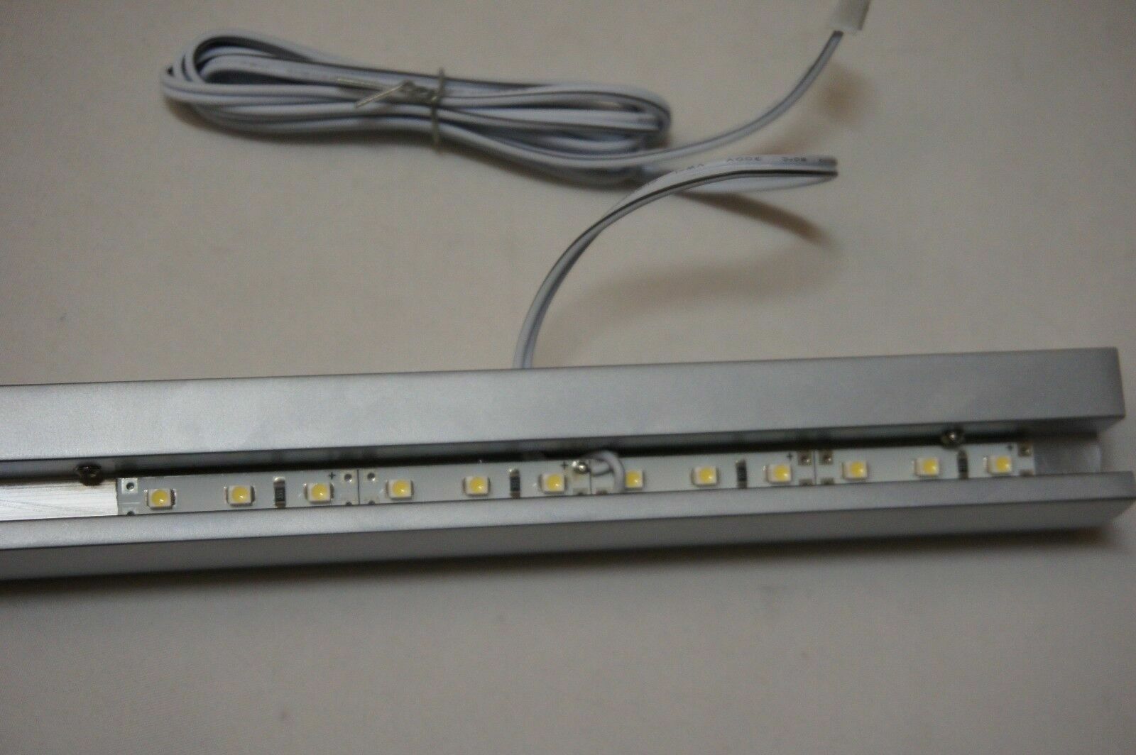 Sign Rail with White LED Lights Create A Backlit Display, Silver Satin
