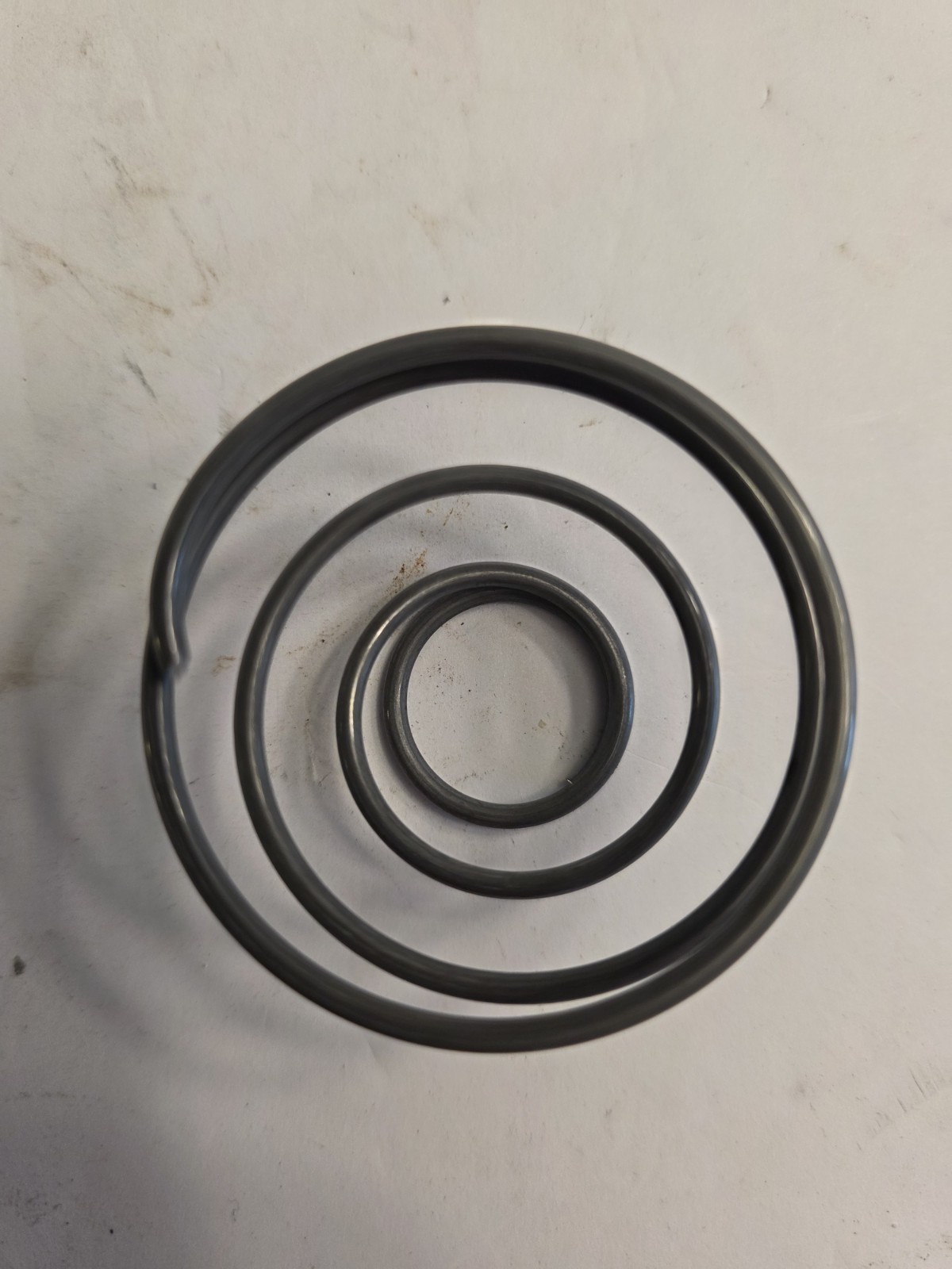 BOX OF 21 NOS AUVECO 1267 TENSION SPRINGS. INSIDE DOOR HANDLES